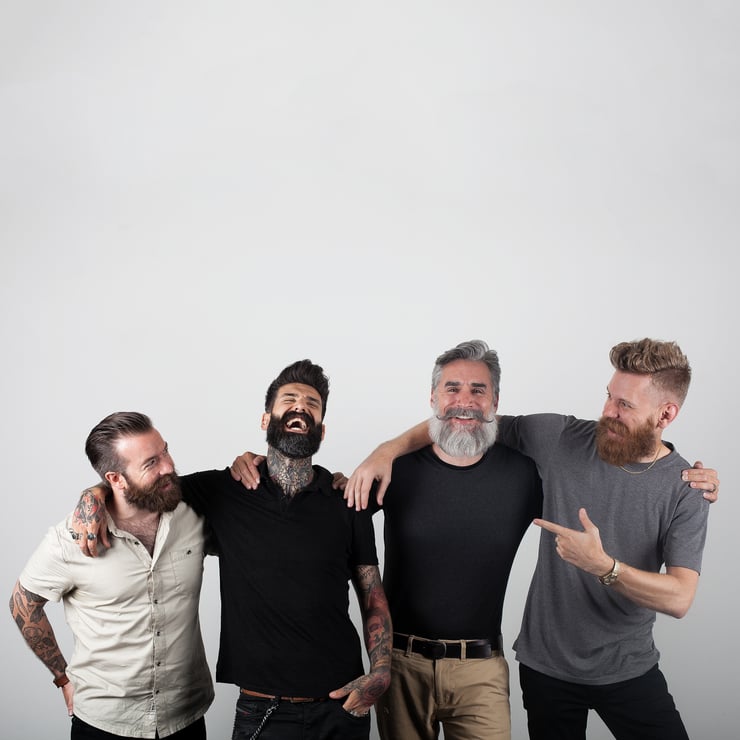 Four men with excellent beards enjoying camaraderie